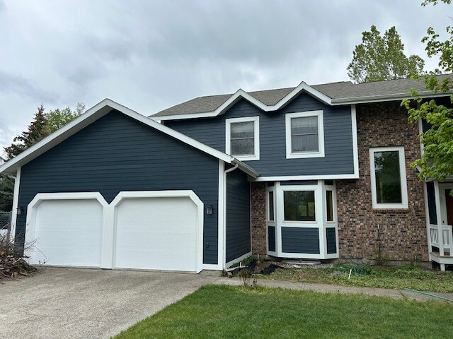 After photo 1 of the completed blue home exterior repaint project