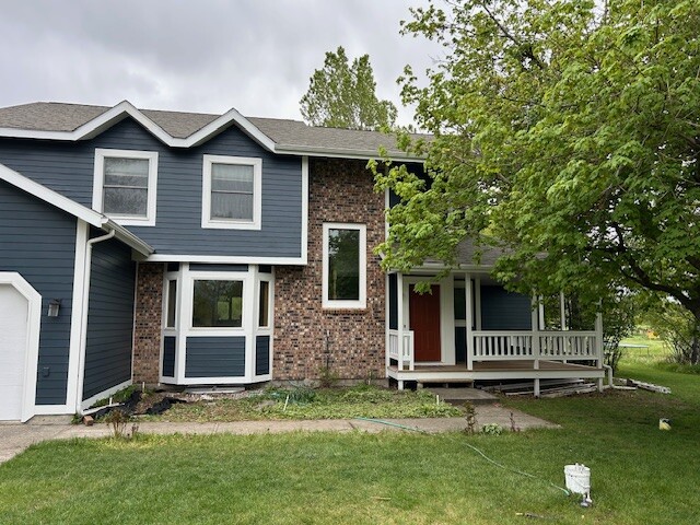 After photo 2 of the completed blue home exterior repaint project