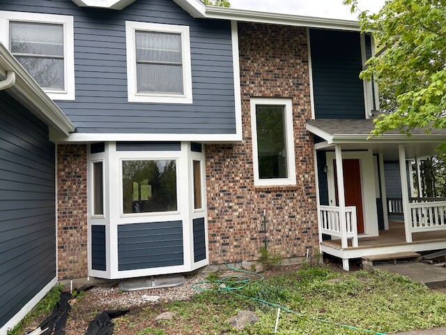 After photo 3 of the completed blue home exterior repaint project