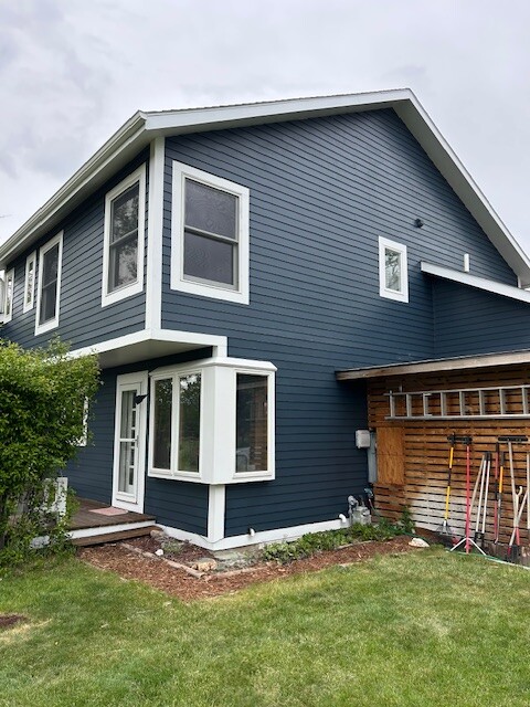 After photo 9 of the completed blue home exterior repaint project