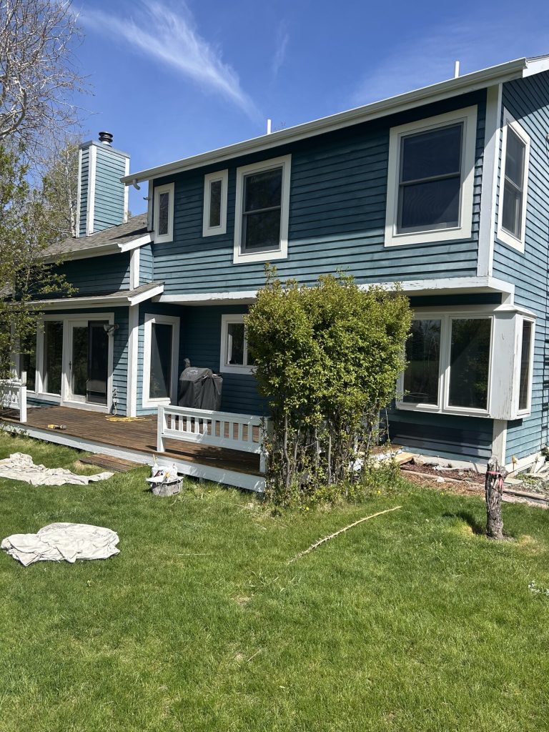 Before photo 1 of the blue home exterior repaint project