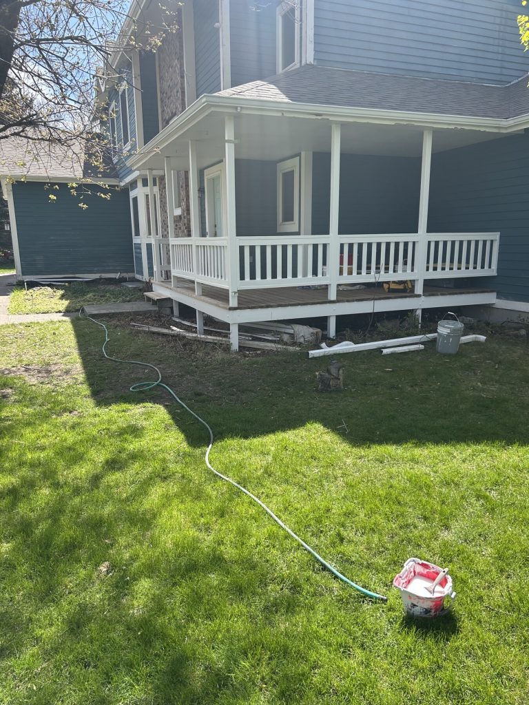 Before photo 4 of the blue home exterior repaint project