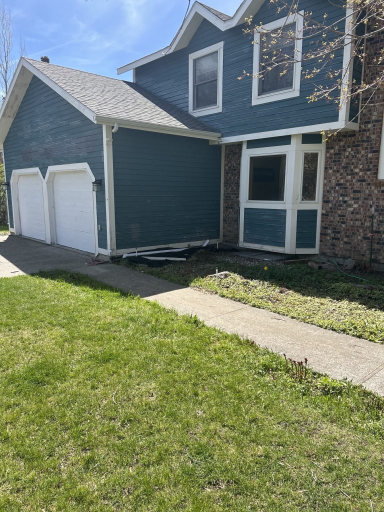 Before photo 5 of the blue home exterior repaint project