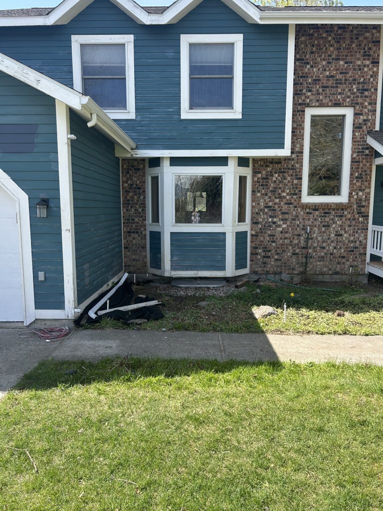 Before photo 7 of the blue home exterior repaint project
